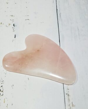 Rose quartz Gua Sha tool for facial massage and relaxation