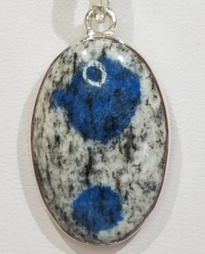 1.25 inch K2 oval sterling silver pendant showing blue azurite inclusions in granite