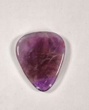 Amethyst guitar pick showcasing unique mineral patterns