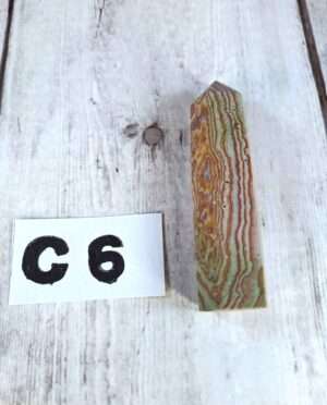 Banded sandstone point with natural layered texture