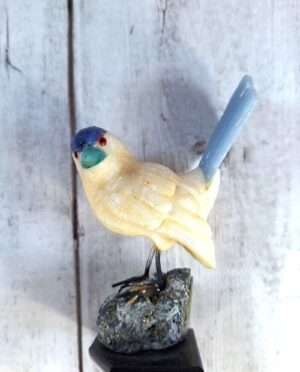 Hand-carved calcite bird figurine with natural translucence and polished finish