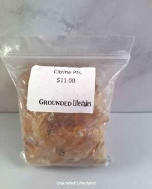 Citrine points pack with small polished quartz crystals showing yellow color