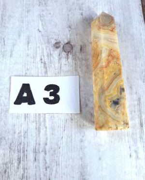 Crazy Lace Agate point with swirling cream red and gold bands