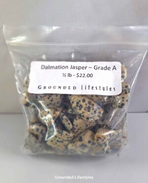 Polished Dalmatian Jasper tumbled stones showing spotted texture