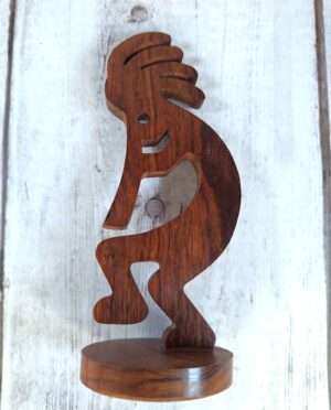 Hand-carved large Kokopelli sculpture from dense desert ironwood