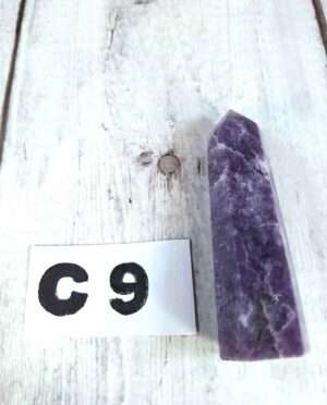 Lepidolite point with soft lavender hues and white streaks