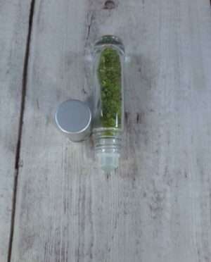 Peridot essential oil roller with gemstone infusion for aromatherapy