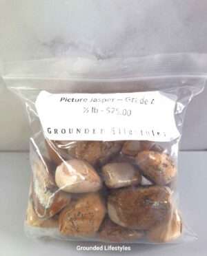 Polished Picture Jasper stones showing layered earth-toned patterns