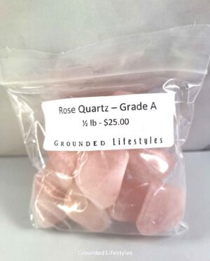 Rose Quartz half pound tumbled stones showing natural pink hues and polished finish