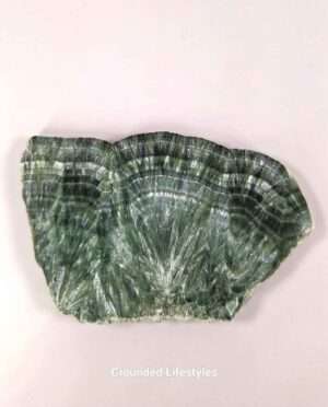 Seraphinite slice from Siberia displaying feather-like patterns