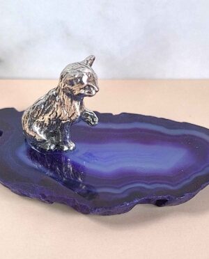 Handcrafted pewter cat perched on a polished agate slice