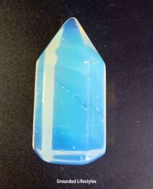 1-inch Opalite crystal tower with translucent white hue and iridescent sheen