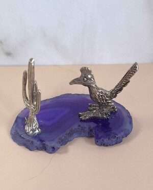 Handcrafted pewter cactus and roadrunner perched atop a natural agate slice