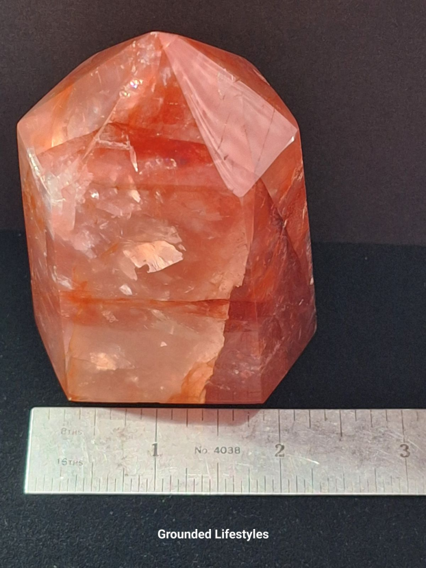3.5 inch hematoid quartz crystal showing red and gold tones from hematite.