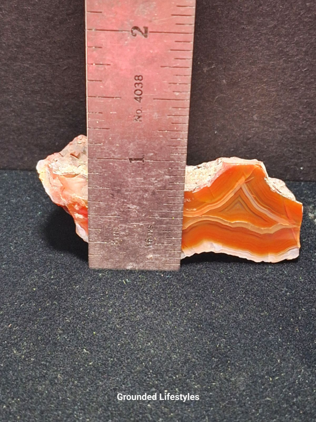 Argentine Condor Agate polished nodule with translucent fortification patterns.