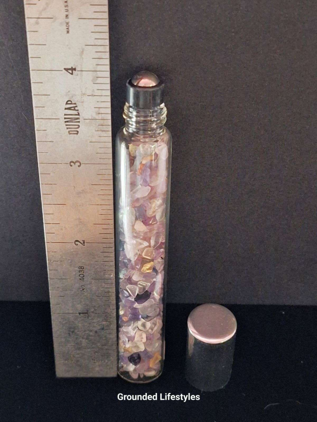 fluorite gemstone roller bottle filled with multicolor chips for oils or perfumes