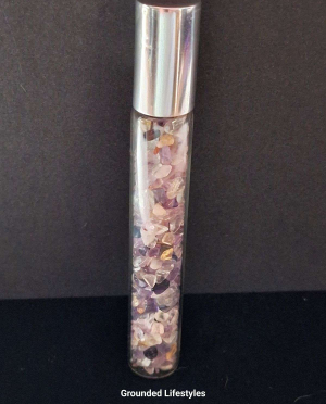 fluorite gemstone roller bottle filled with multicolor chips for oils or perfumes