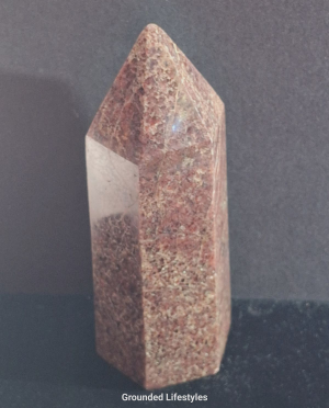 Garnet point from Madagascar 5 inches high showing red crystal inclusions.