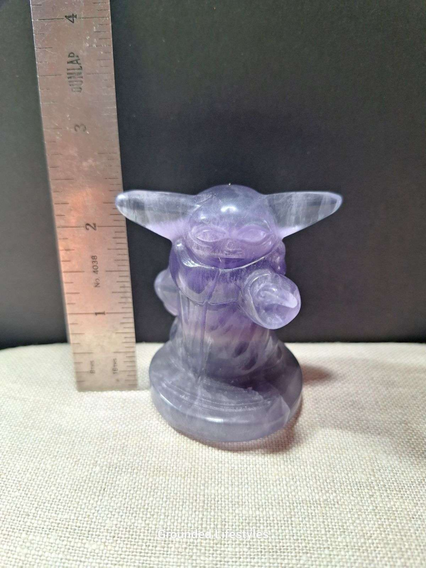 2.25 inch fluorite Grogu carving with purple and green banding