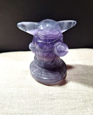 2.25 inch fluorite Grogu carving with purple and green banding