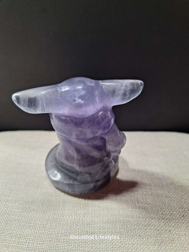2.25 inch fluorite Grogu carving with purple and green banding