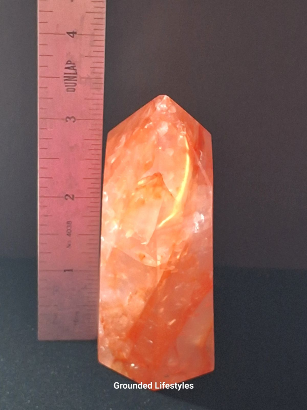 3.5 inch hematoid quartz crystal showing red and gold tones from hematite.