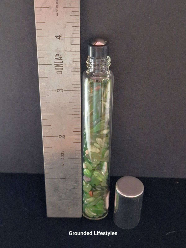 jade gemstone roller bottle filled with green chips for oils or perfumes