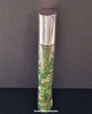 jade gemstone roller bottle filled with green chips for oils or perfumes