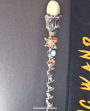 Green aventurine magic wand with resin base and black velvet bag