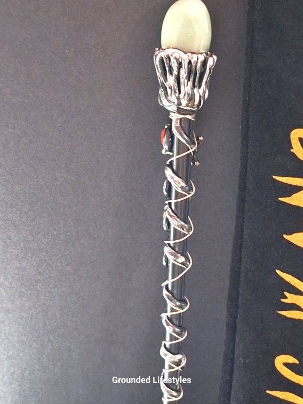 Green aventurine magic wand with resin base and black velvet bag