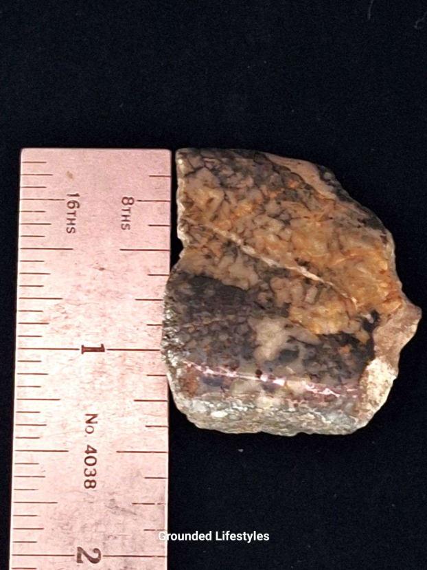 one-inch polished mohawkite specimen from michigan showing copper silver metallic patterns