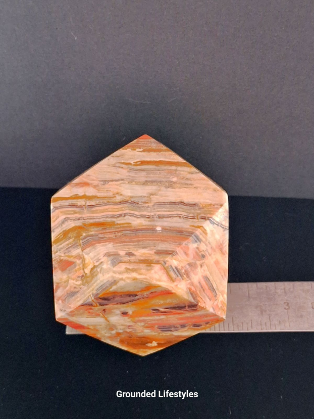 Polished onyx paperweight 2 inches from Pakistan.