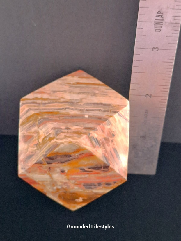 Polished onyx paperweight 2 inches from Pakistan.