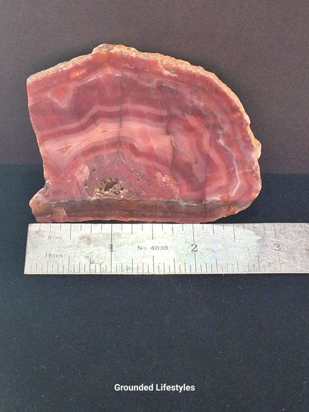 Australian Pilbara Agate polished slice displaying fine concentric bands.