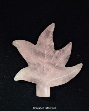 Hand-carved 2 inch rose quartz leaf with soft pink color.