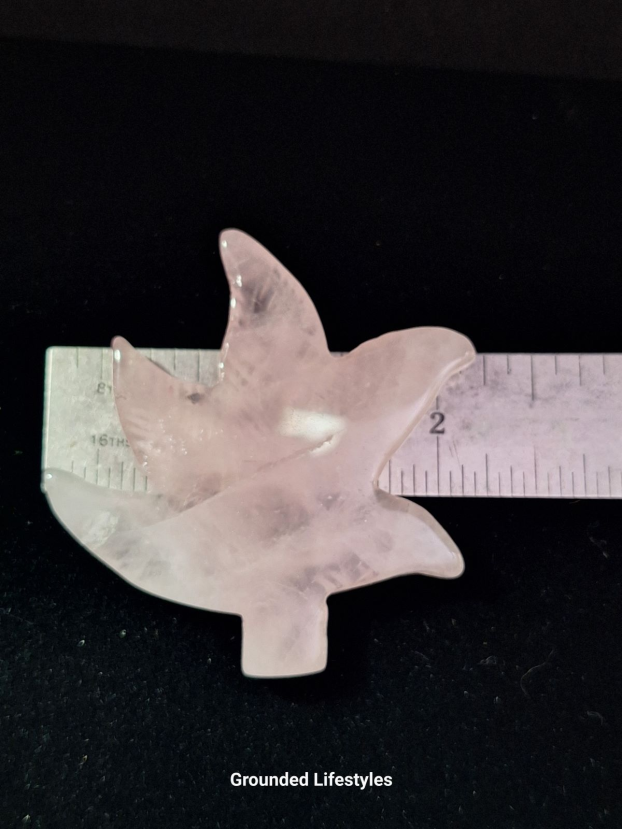Hand-carved 2 inch rose quartz leaf with soft pink color.