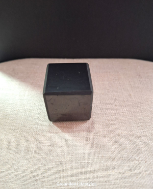 Shungite cube from Russia measuring 1.25 inches with smooth black luster.