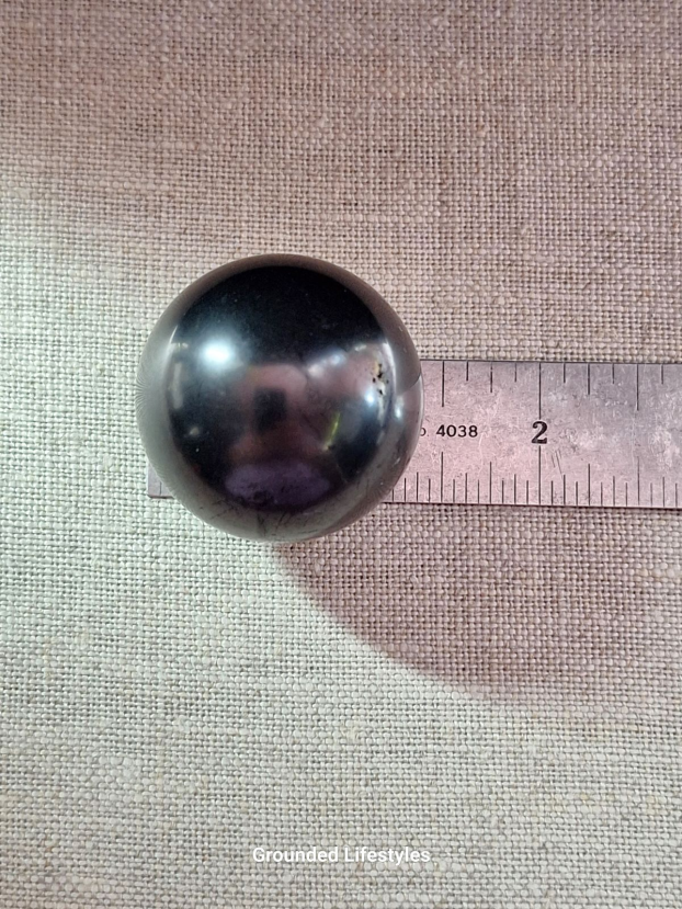 1 inch polished Shungite sphere from Karelia Russia.