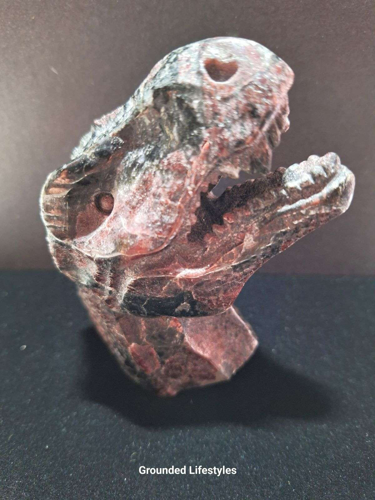 hand-carved garnet T-Rex dinosaur head 3 inch