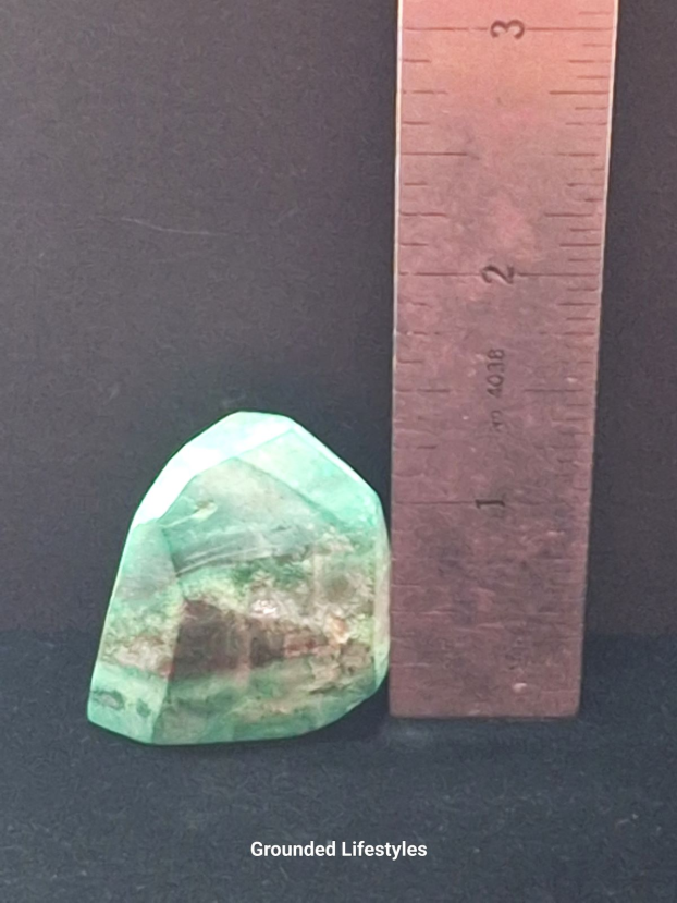Variscite specimen from Morocco measuring 1.25 inches with green coloration.