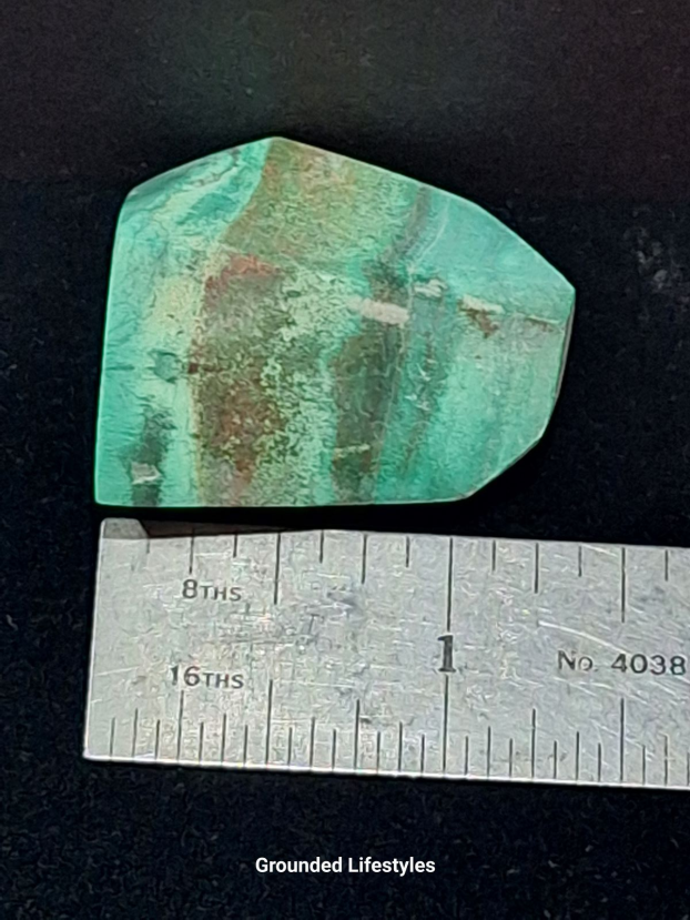 Variscite specimen from Morocco measuring 1.25 inches with green coloration.