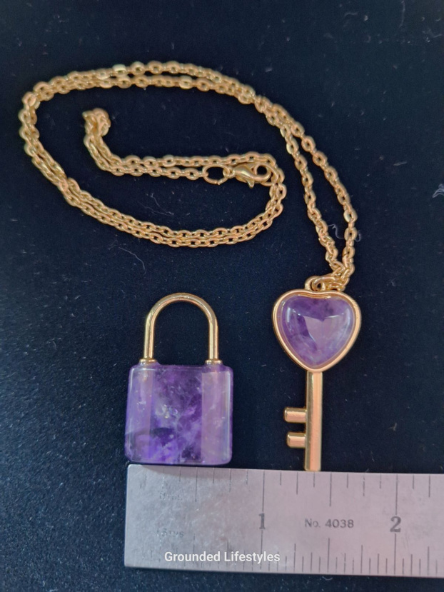 polished amethyst lock and key crystal carvings in box