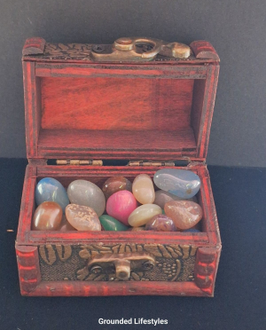 small wooden chest filled with multicolor agate stones 2 inch