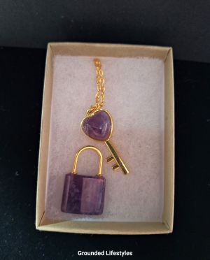 polished amethyst lock and key crystal carvings in box