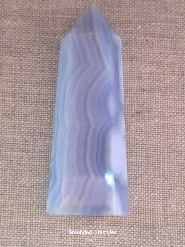 polished blue lace agate point 3 inch showing pale blue stripes