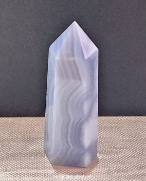 polished blue lace agate point 3 inch showing pale blue stripes
