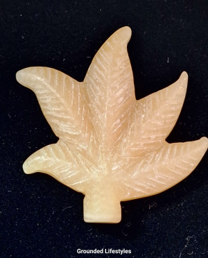 Polished calcite leaf carving 2 inches long.