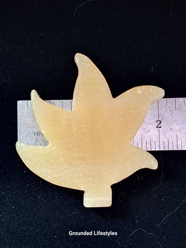 Polished calcite leaf carving 2 inches long.