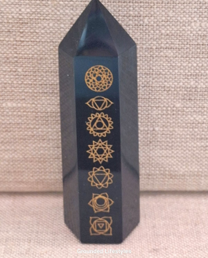 polished 3.25 inch obsidian point engraved with gold chakra designs