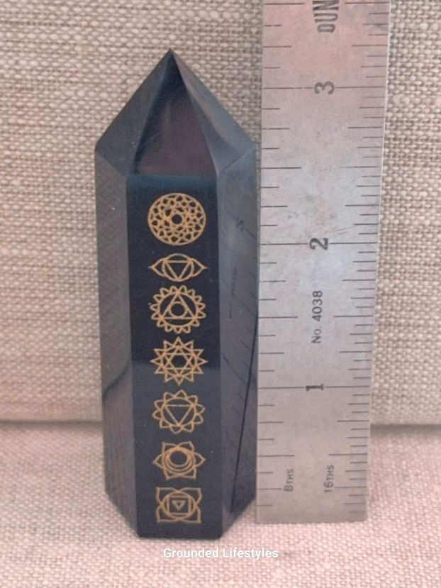 polished 3.25 inch obsidian point engraved with gold chakra designs